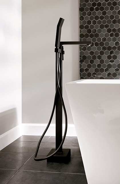 Install a floor-mount bathtub faucet