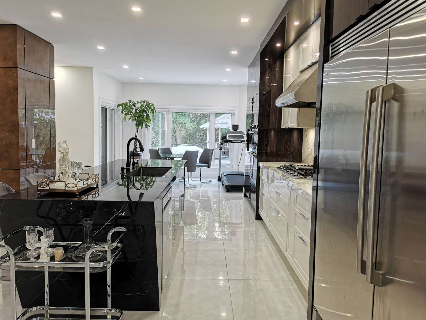Modern & Contemporary Kitchen Featuring Angled Central Island and Painted High Gloss Cabinet in White